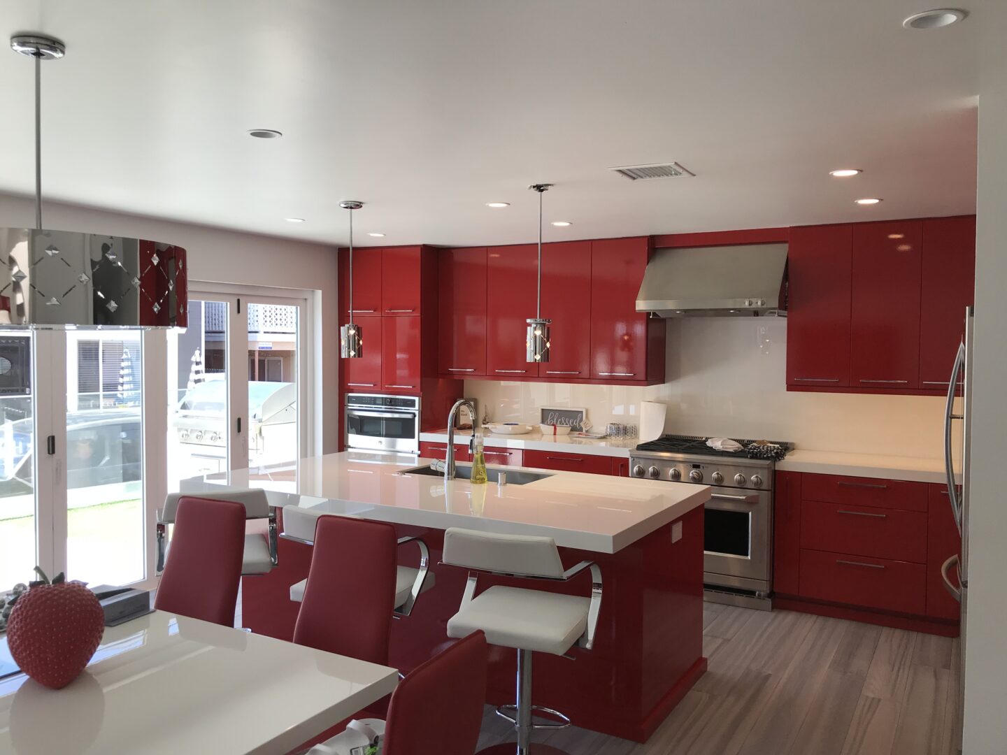 A kitchen and dining area with red furniture