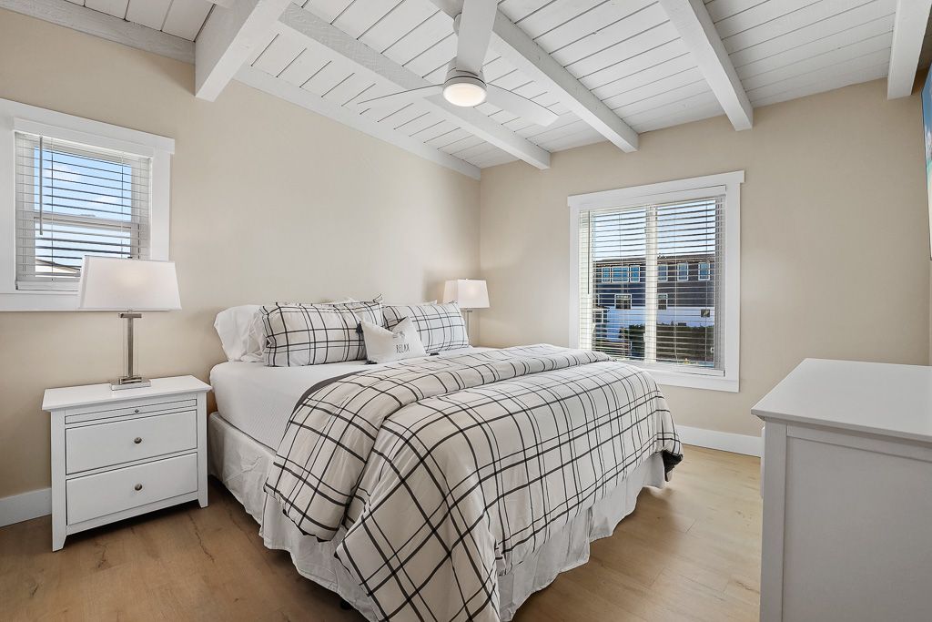 A bedroom with a huge ceiling fan